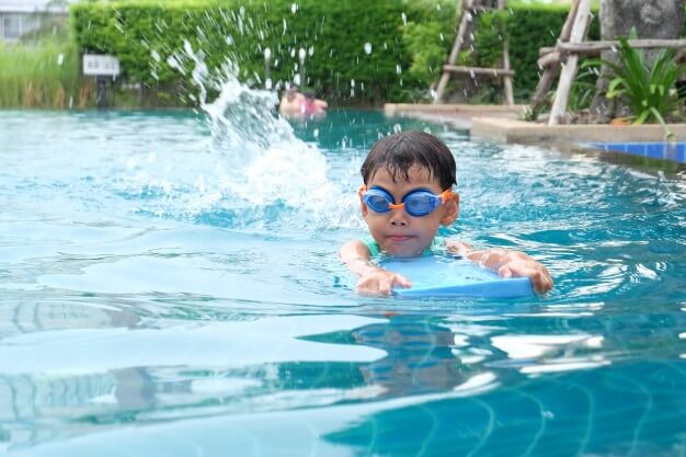 Asian kid swimming